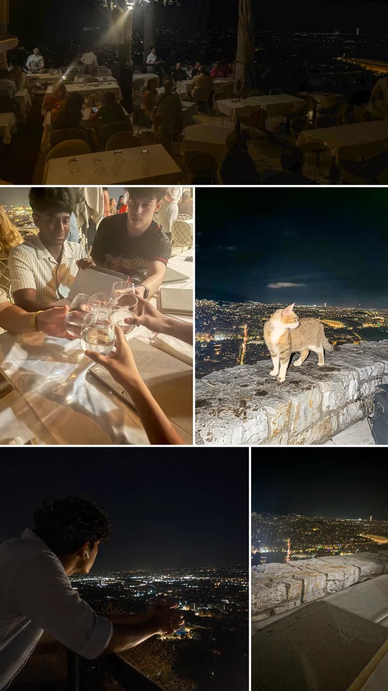 Rooftop dinner above Athens at night with the city lights below